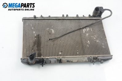 Water radiator for Nissan Primera (P10) 2.0, 116 hp, station wagon, 5 doors, 1995