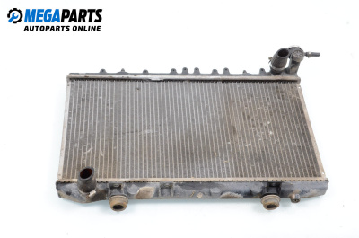 Water radiator for Nissan Primera Sedan I (06.1990 - 06.1996) 1.6, 90 hp