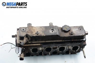 Engine head for Ford Focus I 1.8 TDDi, 90 hp, station wagon, 1999