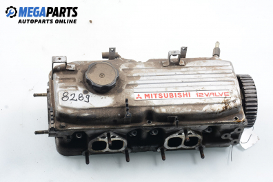 Engine head for Mitsubishi Colt IV 1.3 12V GLI, 75 hp, hatchback, 3 doors, 1993