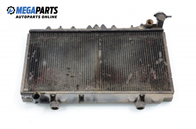 Water radiator for Nissan Primera 1.6, 90 hp, sedan, 1994